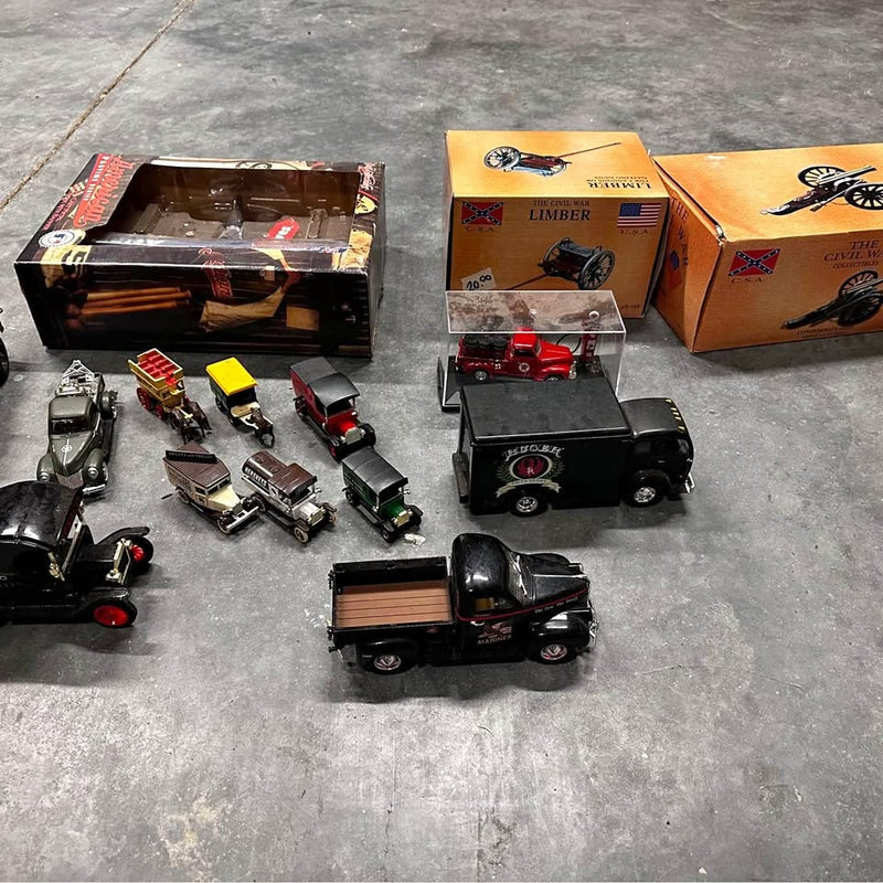 Diecast vehicle set with assorted trucks and cars, including black and red models
