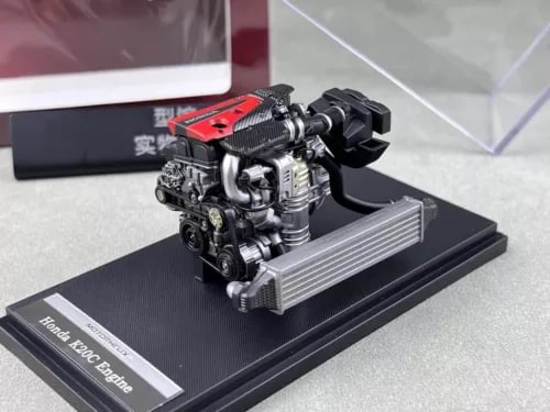 1:18 diecast turbo engine model on black display base with red intake cover
