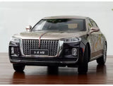 Diecast car model, front view, dark body with chrome grille and gold accents