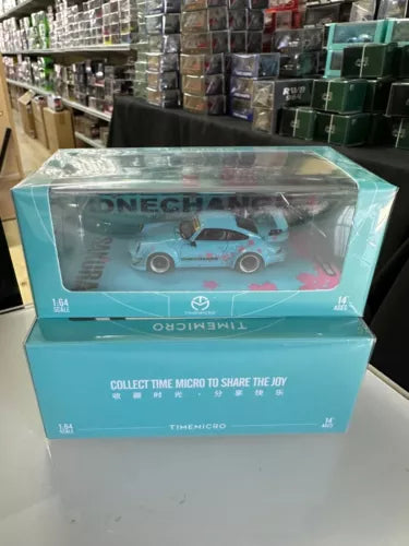 Light blue PORSCHE 964 diecast car model in retail box by TIME MICRO