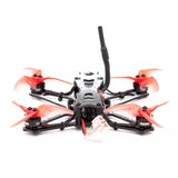 Freestyle RC FPV racing drone with orange quad rotors, central camera mount, antenna