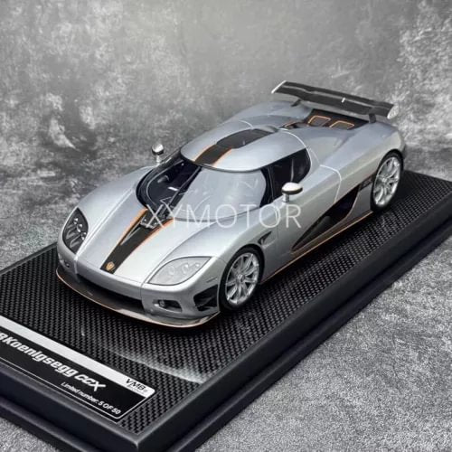 Silver 1:18 resin diecast supercar model on display base