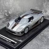 Silver 1:18 resin diecast supercar model on display base