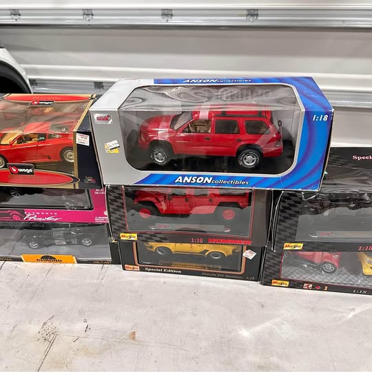 1:18 diecast red SUV in original display box, windowed front