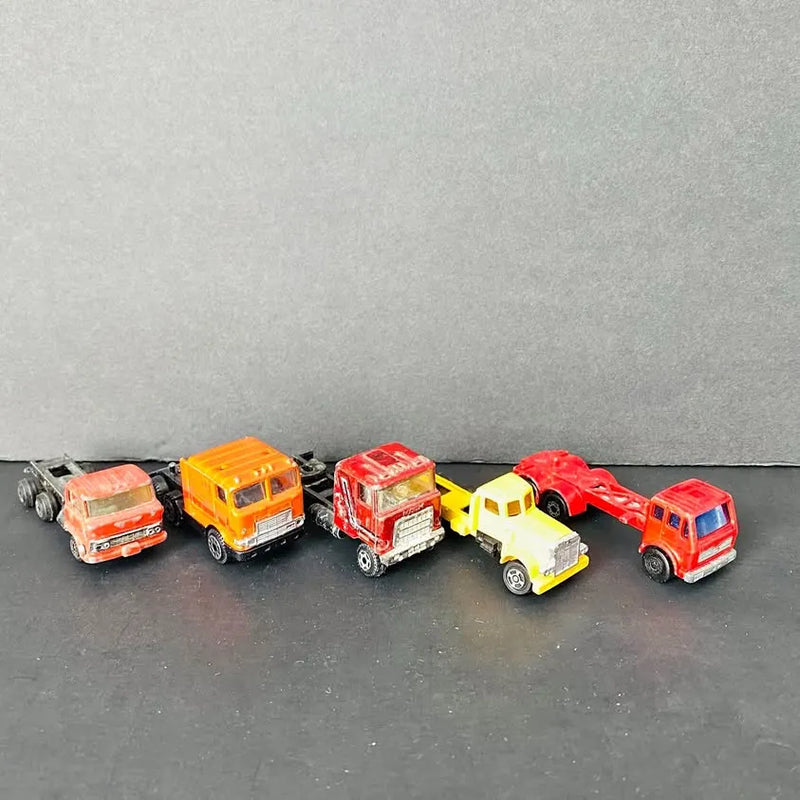 Set of five vintage diecast semi trucks, assorted colors, detailed cab and trailer.