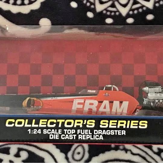 Red die-cast dragster model with FRAM engine and Collector's Series branding