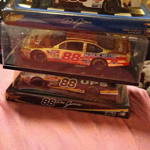 NASCAR diecast car in display box, #88 Ford Credit, red race car
