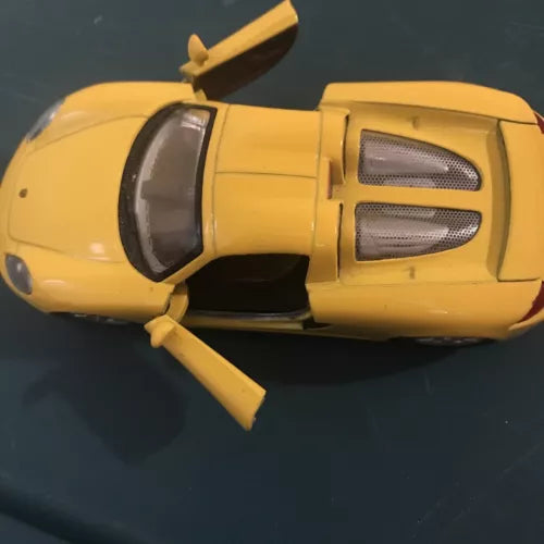 Kinsmart Porsche Carrera GT yellow diecast model toy car, front-side view