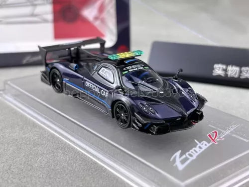 1:64 scale diecast race car, dark blue with black hood, on display base