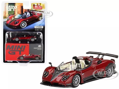 Red and black 1/64 diecast race car model with open cockpit and front details