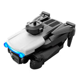 Mini quadcopter drone with front dual camera lenses, gray body.