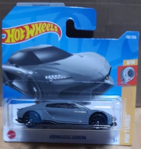 Hot Wheels diecast model car of Koenigsegg GEMERA, dark grey, front 3/4 view