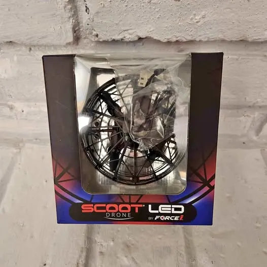Scoot LED drone retail box with visible propeller and foil-packed components