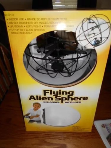 Remote control drone in retail box, black quadcopter illustration and large circular graphic