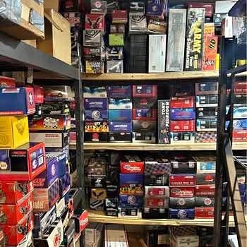 Diecast toy cars in retail boxes on store display shelves