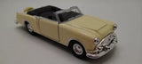 Beige convertible diecast metal car with black interior and chrome front detail