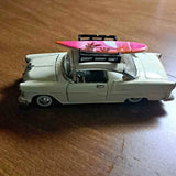 Light green diecast classic car with open hood and pink engine cover