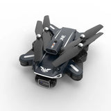 Mini FPV quadcopter drone with four dark propellers and onboard camera