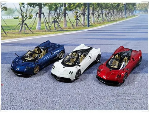 Diecast supercar model cars in blue, white, and red, front view.