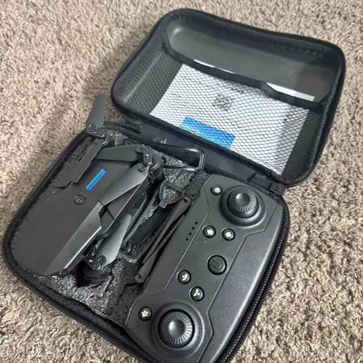 Drone with camera in zippered hard case, controller with screens and buttons
