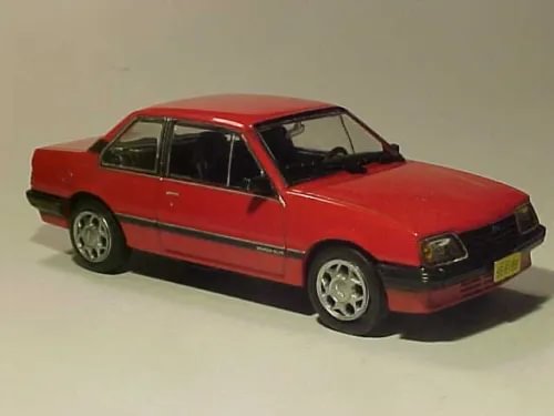Red diecast model car, classic four-door sedan with silver wheels
