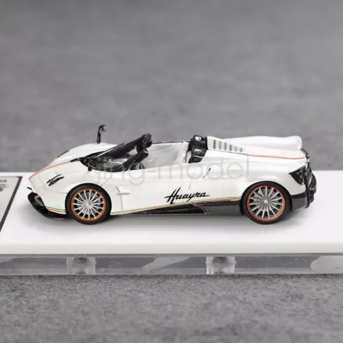 1:64 scale white convertible sports car model with black details and silver wheels
