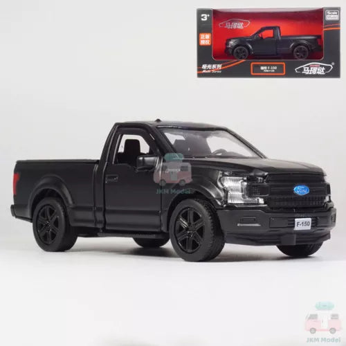 Matte black pickup truck diecast model with open door, front three-quarter view