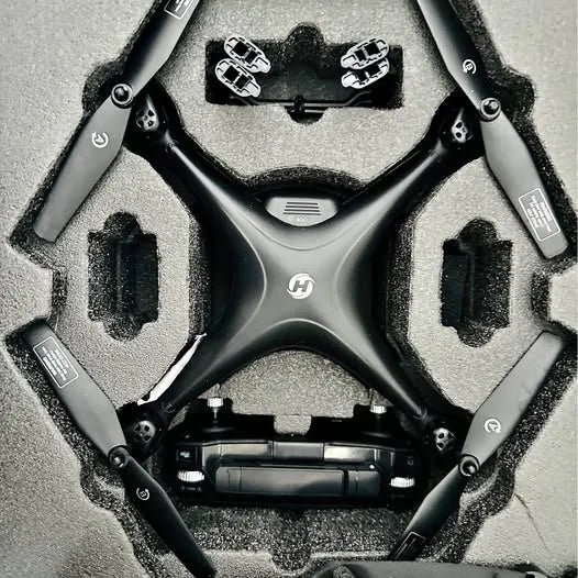 Black FPV drone with GPS, top view, four arms and prop guards