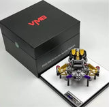 Diecast engine model with acrylic parts in presentation case, featuring gold and black detail