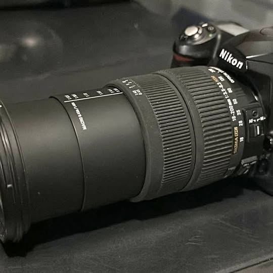 Nikon DSLR camera with Sigma 18-200mm lens, front view