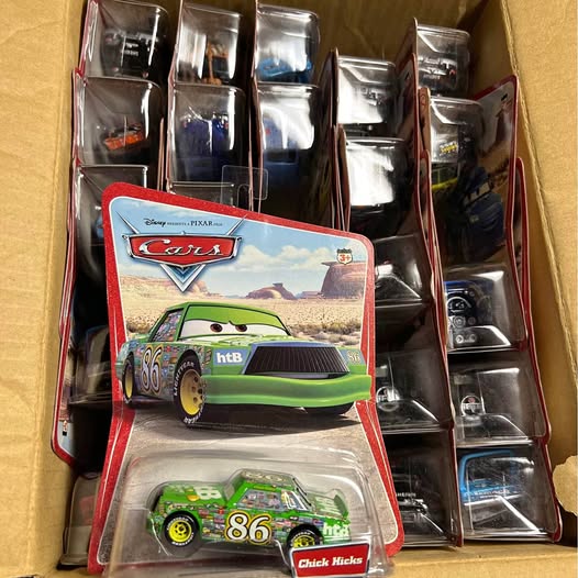 Green die-cast race car #86 in clear blister packaging