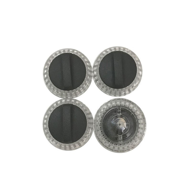 Set of four circular light protector covers, transparent rim with dark center pads