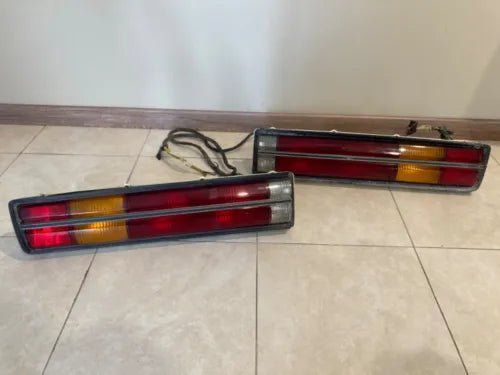 Diecast car rear light set with red and amber lenses, with wiring harness