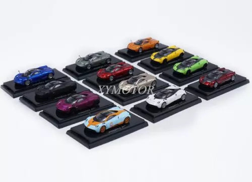 Assorted diecast supercar model toys on display bases, orange, blue, red, black cars