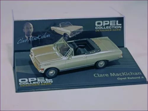 Beige convertible diecast model car with black interior in display box