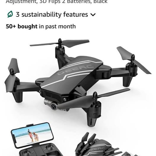Black quadcopter drone with four propellers and front camera, with phone controller.