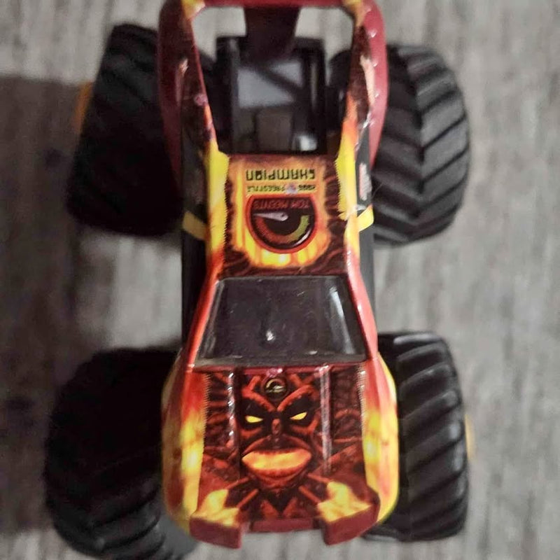 Monster Jam Phoenix AZ diecast monster truck, red-orange flame graphics and large wheels