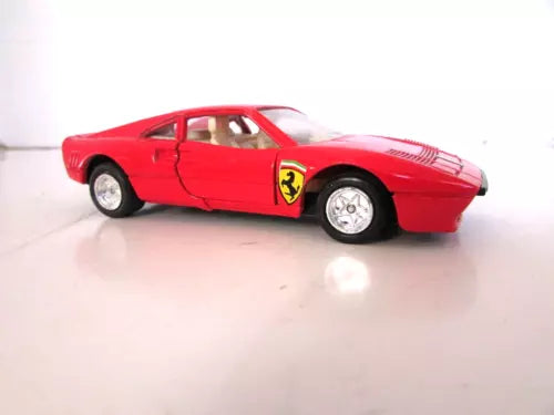 Red 1/36 scale diecast Ferrari 288 GTO toy car, side view