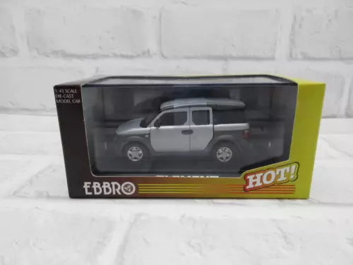 1:43 diecast car model in box, silver metallic pickup with black wheels