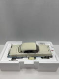 Diecast 1956 Packard Caribbean hardtop model car, cream with black roof