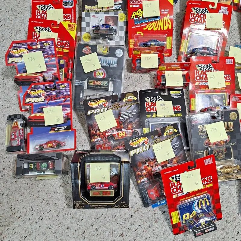 1/64 scale NASCAR diecast cars in retail boxes, stacked
