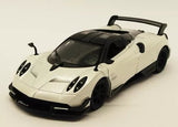 White diecast model sports car with black hood details, front three-quarter view