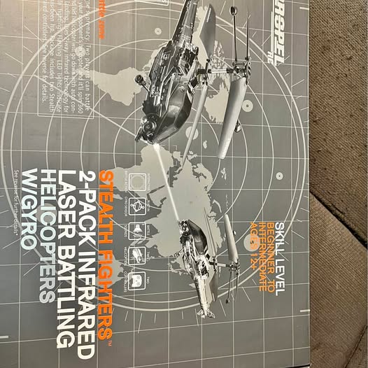Fighting drone with twin rotor arms and landing gear, shown in dark gray.