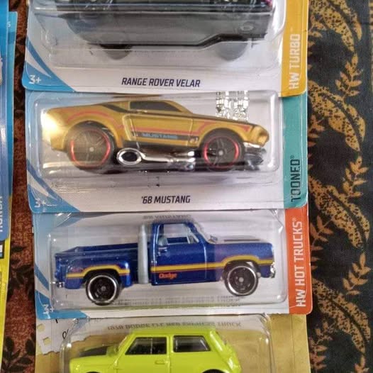 Diecast car set with three vehicles: green car, blue pickup, and yellow Mustang.