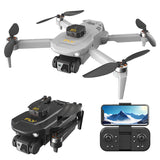 Mini quadcopter RC drone with four propellers, camera module, and handheld controller with screen