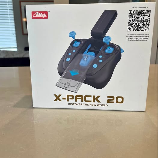 Mini drone controller box, dark controller with blue joysticks and display, X-BACK 20