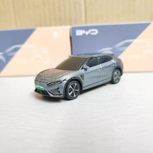 Grey diecast car model toy with open hood detail, 1:64 scale