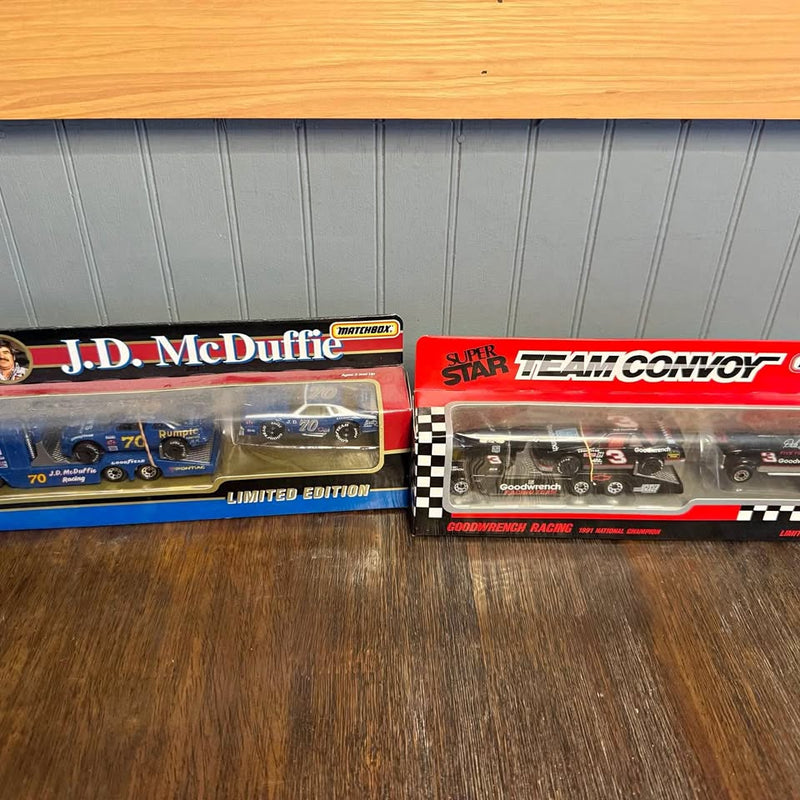 Vintage NASCAR diecast car lot, two new-in-box race cars in blue and dark, limited edition.