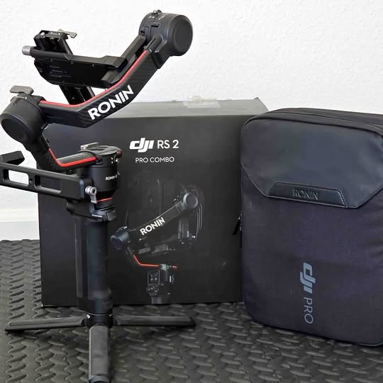 Camera gimbal stabilizer kit with mounted gimbal and dark carrying case