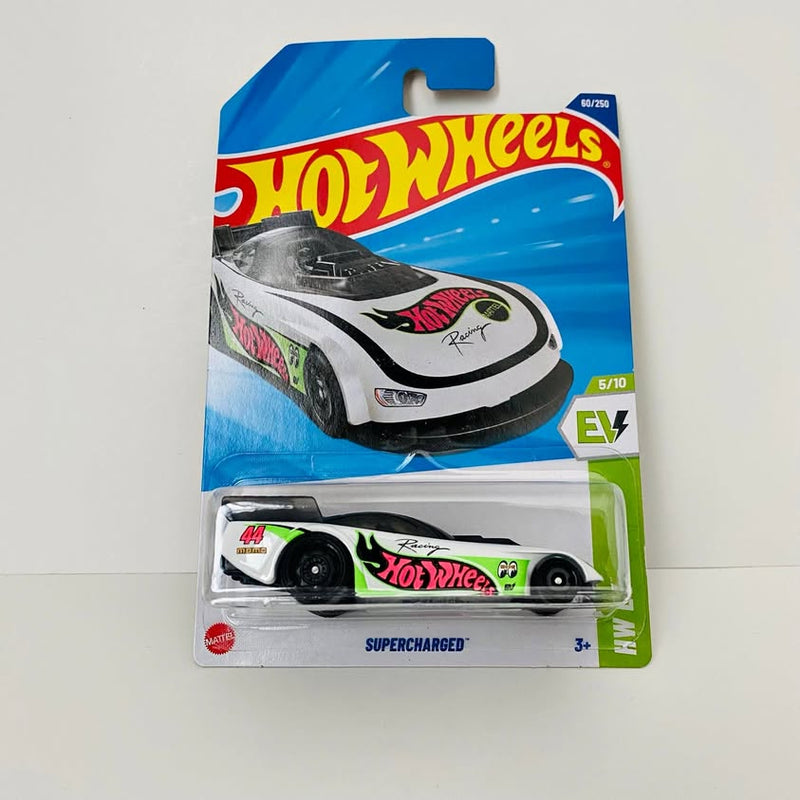 White and black diecast race car toy in Hot Wheels EV blister pack